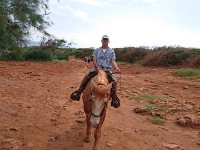 Mike on Thor (a grey horse dyed red from soil!)