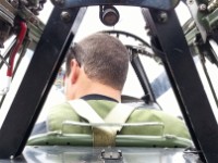 2016-07-04-10-27-39-0913  The back of the pilot Rob's head. In the mirror above you can see my Lightspeed headset which I am about to don.